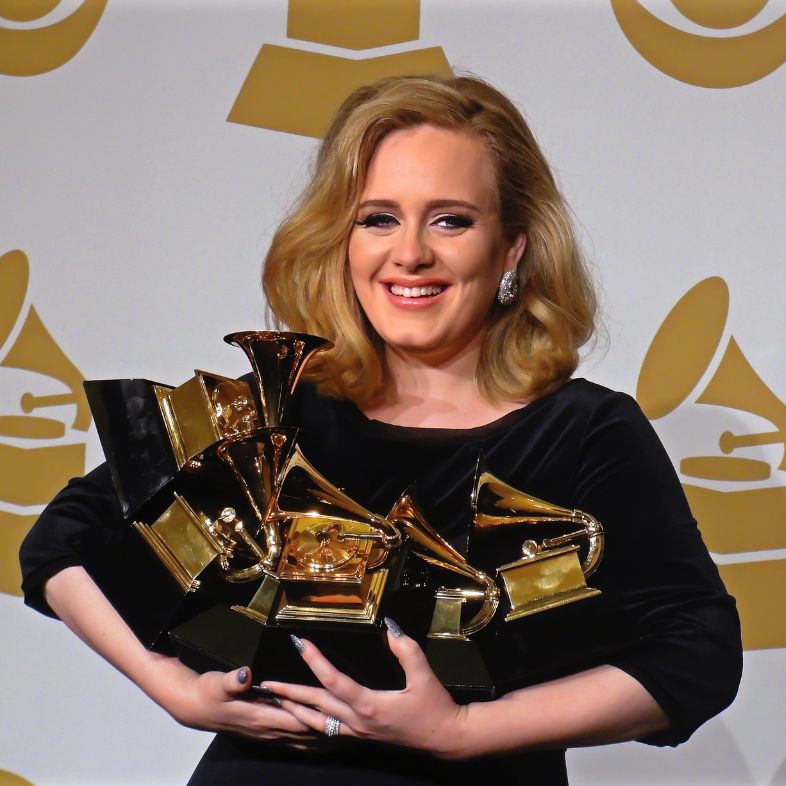 Famous singer-songwriter, Adele judges the multiple trophies received at the Grammy Awards