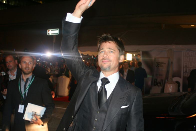 Famous actor Brad Pitt waves to fans at the Toronto International Film Festival