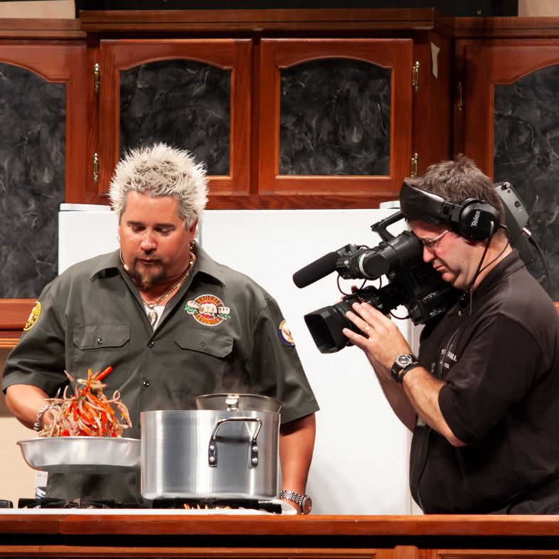 Guy Fieri Food network star, chef, restaurant owner, host of Guy`s Grocery Games, Diner`s Drive-in`s and Dives, and Kids Baking Champioship, here on location doing a cooking demo promoting himself and gaining more fans