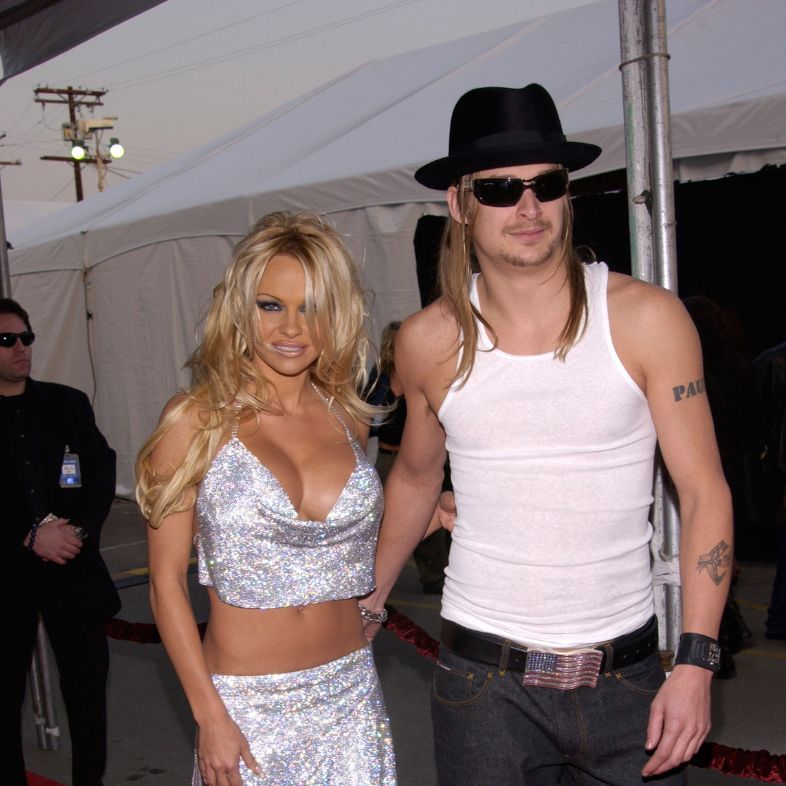 Actress PAMELA ANDERSON and friend KID ROCK at the American Music Awards in Los Angeles. January 9, 2002.