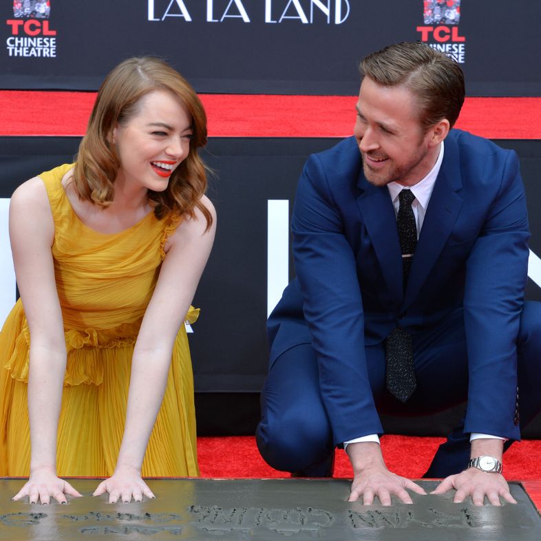 LOS ANGELES, CA - DECEMBER 7, 2016: Actors Emma Stone & Ryan Gosling at the TCL Chinese Theatre, Hollywood, where the stars of La La Land had their hand & footprints set in cement