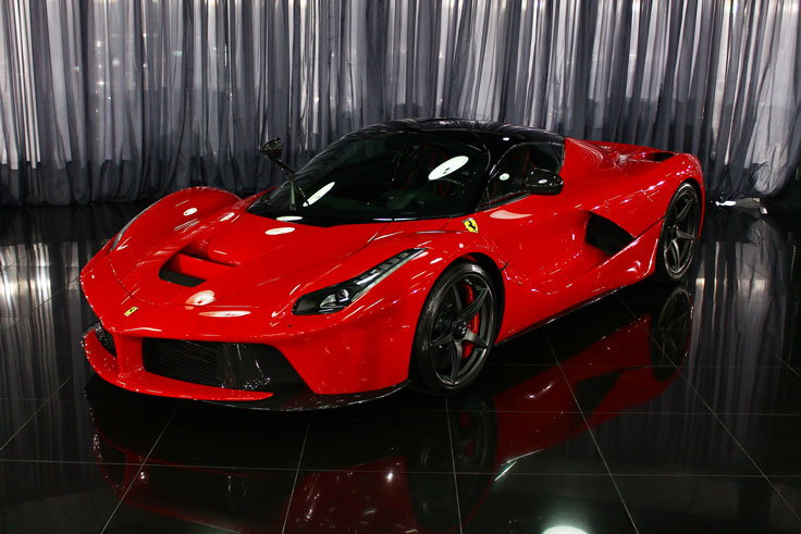 ID 84752908 © Bographics | Dreamstime.com - Still photo of a red Ferrari LaFerrari hybrid supercar inside a nice showroom. This machine has almost 1000 horse power from both V12 and electric engine, reaching a speed of almost 350 km/h.